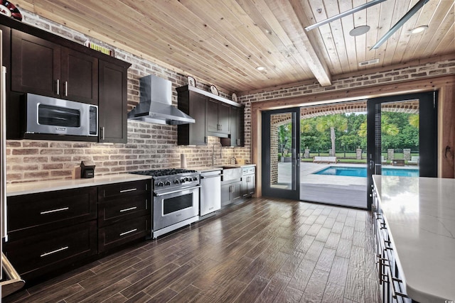 kitchen featuring dark brown cabinetry, wall chimney exhaust hood, dark wood-type flooring, stainless steel appliances, and wooden ceiling