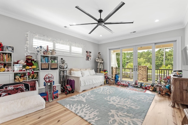 bedroom featuring ceiling fan, crown molding, access to exterior, and wood-type flooring