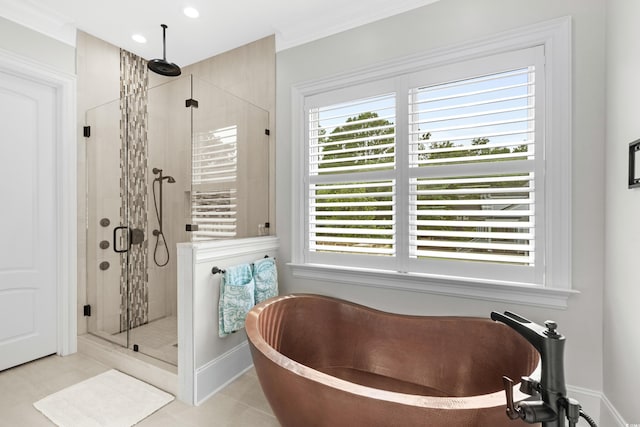 bathroom featuring ornamental molding, tile patterned floors, and independent shower and bath