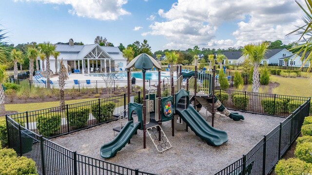 view of playground featuring a community pool