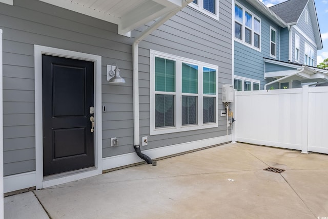 entrance to property with a patio area