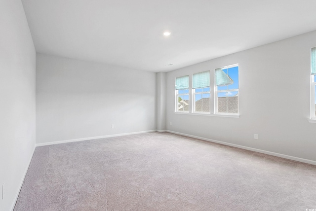 empty room featuring light colored carpet