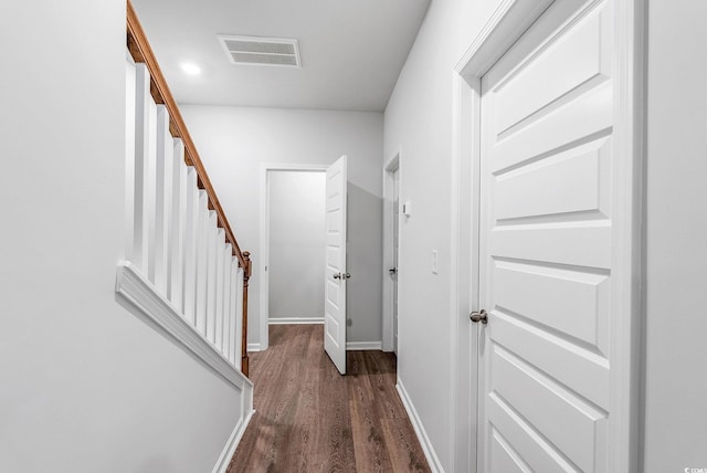 hallway featuring dark hardwood / wood-style floors