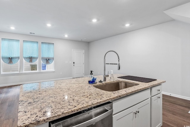 kitchen featuring sink, stainless steel dishwasher, white cabinets, light stone counters, and dark hardwood / wood-style floors