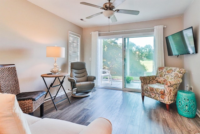 living area featuring ceiling fan and wood-type flooring