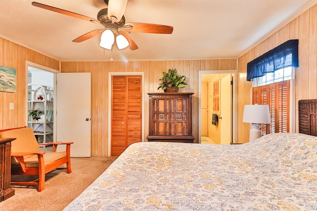 bedroom featuring ceiling fan, light colored carpet, wooden walls, and ornamental molding