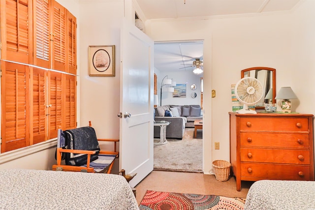 bedroom featuring light carpet and ornamental molding