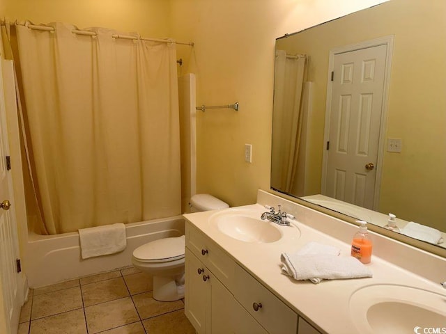 full bathroom with vanity, tile patterned floors, toilet, and shower / tub combo with curtain