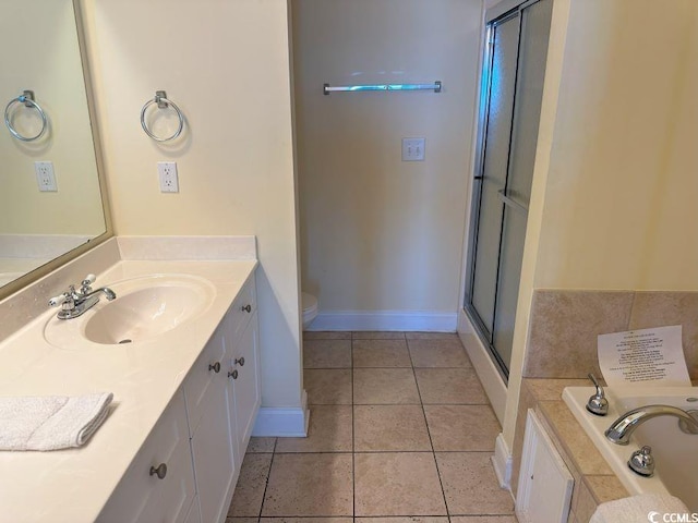 full bathroom featuring independent shower and bath, vanity, tile patterned flooring, and toilet