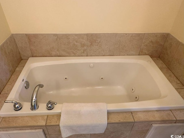 bathroom featuring tiled bath