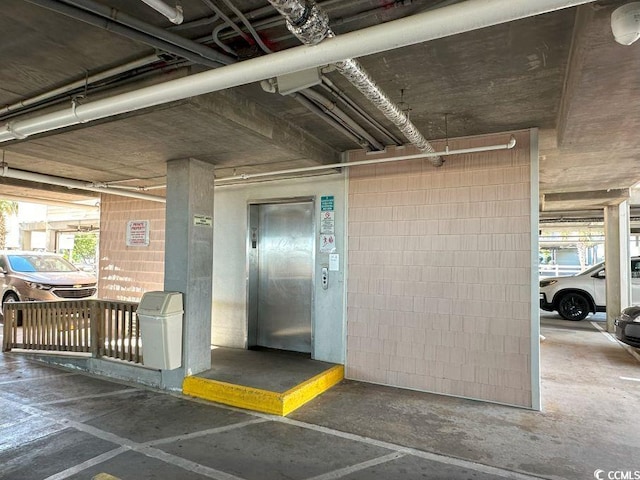 doorway to property featuring elevator