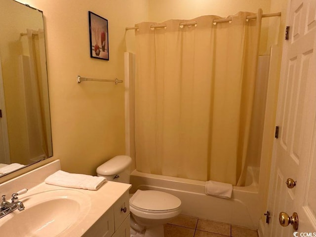 full bathroom featuring shower / tub combo with curtain, tile patterned floors, vanity, and toilet