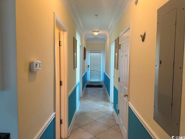 hall featuring electric panel, ornamental molding, and light tile patterned floors