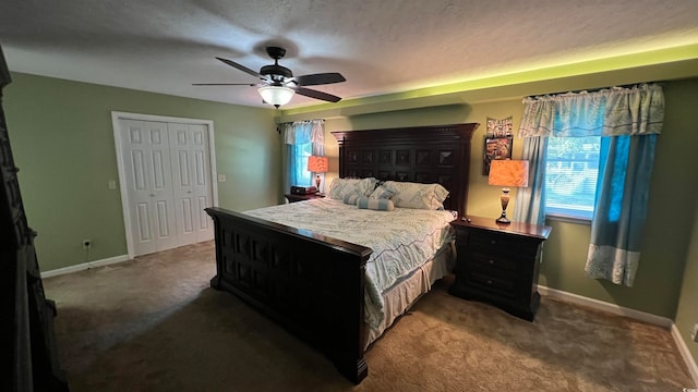 bedroom featuring ceiling fan, a textured ceiling, a closet, and carpet