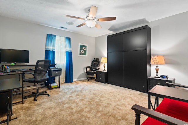 office featuring light colored carpet and ceiling fan