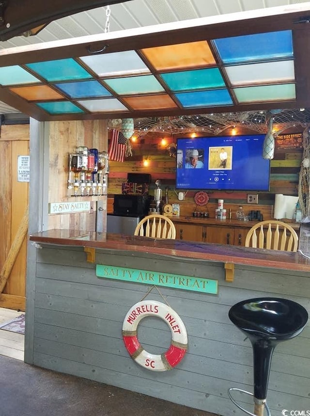 bar with wood walls and a barn door