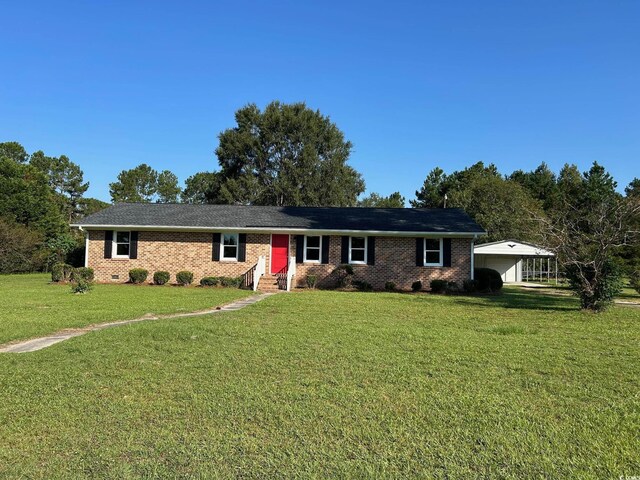 single story home with a front lawn