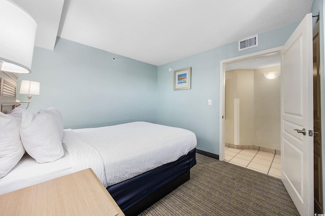 2301 Ocean Blvd S Unit 1218, Myrtle Beach, SC 29577 - bedroom featuring tile patterned floors and baseboards