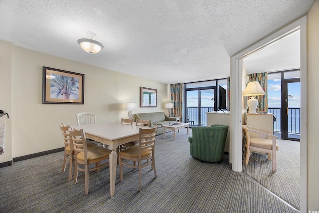 2301 Ocean Blvd S Unit 1218, Myrtle Beach, SC 29577 - carpeted dining space featuring floor to ceiling windows, a textured ceiling, and baseboards