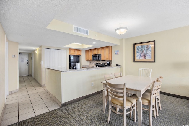 2301 Ocean Blvd S Unit 1218, Myrtle Beach, SC 29577 - dining space featuring a textured ceiling, baseboards, light carpet, and light tile patterned flooring