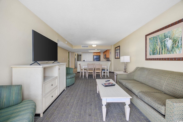 2301 Ocean Blvd S Unit 1218, Myrtle Beach, SC 29577 - living room featuring dark carpet