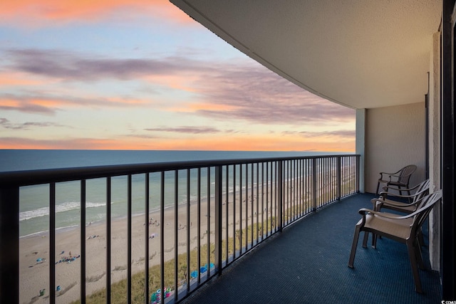 2301 Ocean Blvd S Unit 1218, Myrtle Beach, SC 29577 - balcony at dusk featuring view of water and beach