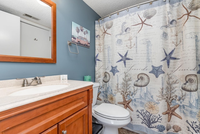 bathroom featuring a textured ceiling, a shower with shower curtain, vanity, and toilet