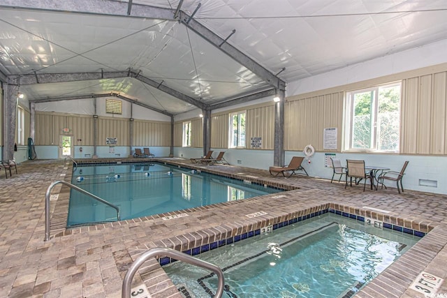 view of swimming pool with an indoor in ground hot tub