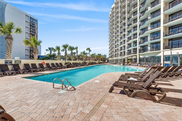 7100 N Ocean Blvd Unit 913, Myrtle Beach, SC 29572 - community pool featuring a patio