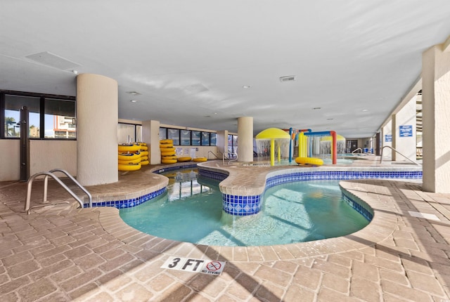 view of swimming pool featuring a patio area