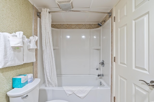 bathroom featuring shower / bath combo and toilet