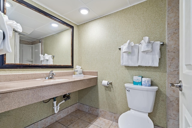 bathroom featuring tile patterned flooring, sink, and toilet