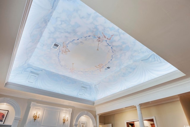 interior details featuring ornate columns, visible vents, and crown molding