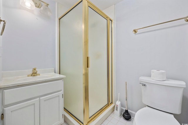 bathroom featuring a stall shower, toilet, tile patterned flooring, and vanity