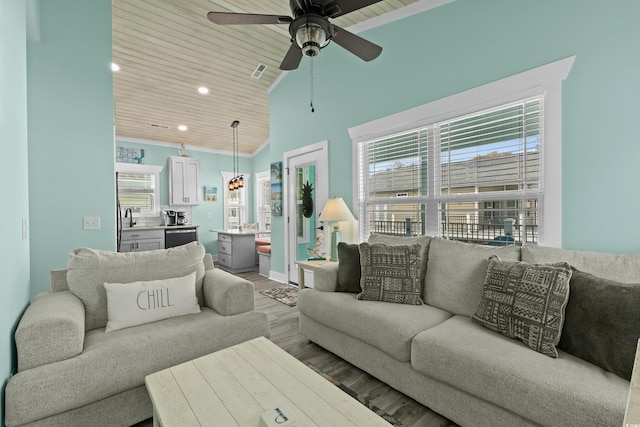 living room featuring ceiling fan, wooden ceiling, vaulted ceiling, and wood-type flooring