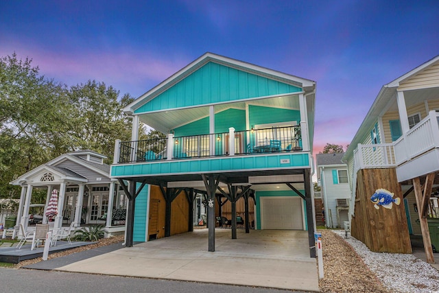 raised beach house featuring a carport