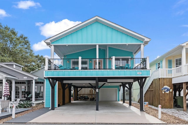 beach home featuring a garage and a carport