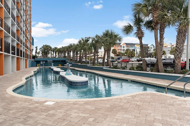 view of swimming pool featuring a patio