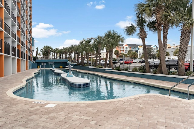 community pool featuring fence