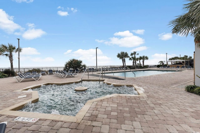 view of swimming pool featuring a patio area