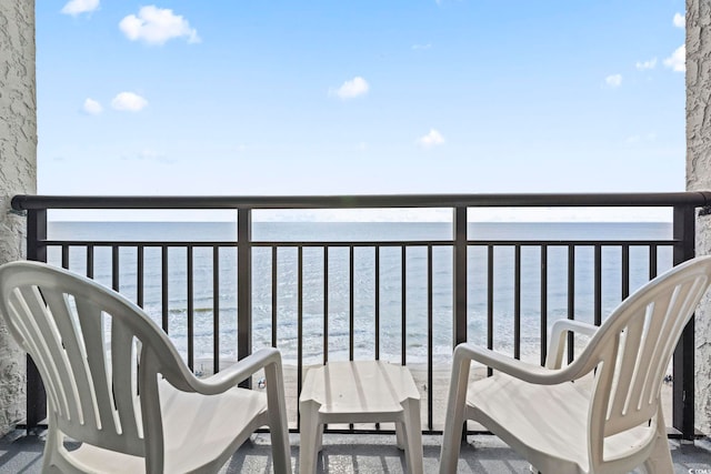 balcony featuring a water view