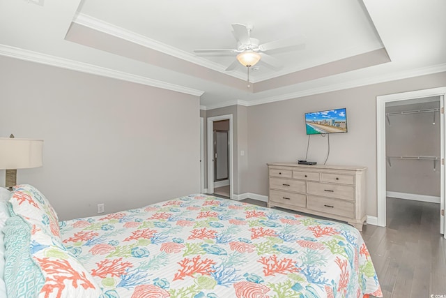 6001-MH32A S Kings Hwy, Myrtle Beach, SC 29575 - bedroom with ornamental molding, a walk in closet, ceiling fan, a raised ceiling, and a closet
