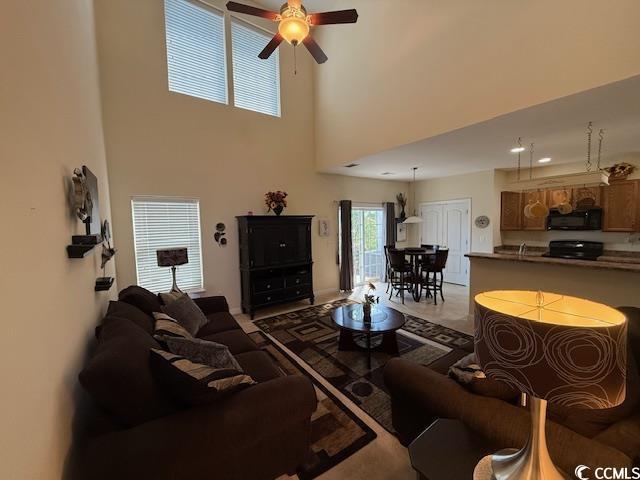 1188 Fairway Ln Unit 7, Conway, SC 29526 - living room with ceiling fan and a high ceiling