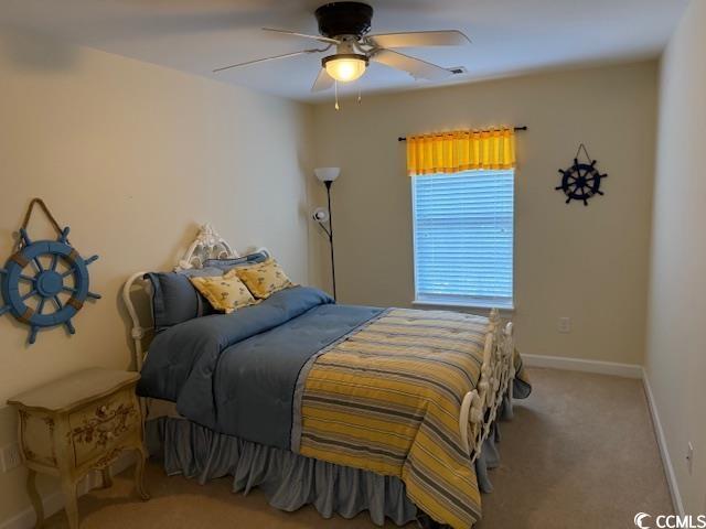 1188 Fairway Ln Unit 7, Conway, SC 29526 - carpeted bedroom featuring a ceiling fan and baseboards
