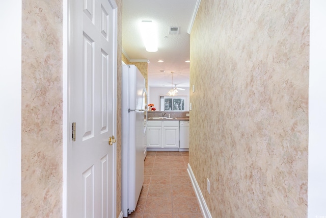 1100 Commons Blvd Unit 107, Myrtle Beach, SC 29572 - hall featuring light tile patterned flooring and ornamental molding