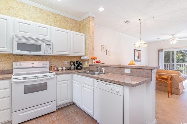 kitchen featuring kitchen peninsula, white appliances, sink, and white cabinets