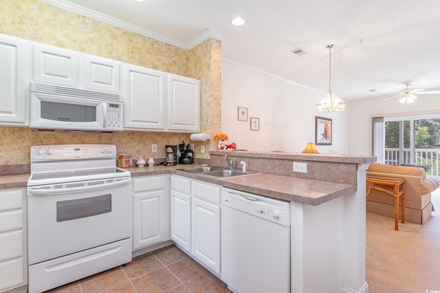 1100 Commons Blvd Unit 107, Myrtle Beach, SC 29572 - kitchen with white appliances, a sink, a peninsula, ornamental molding, and white cabinets