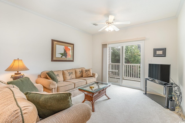 carpeted living room with crown molding and ceiling fan