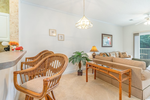 interior space featuring ornamental molding, light carpet, and ceiling fan