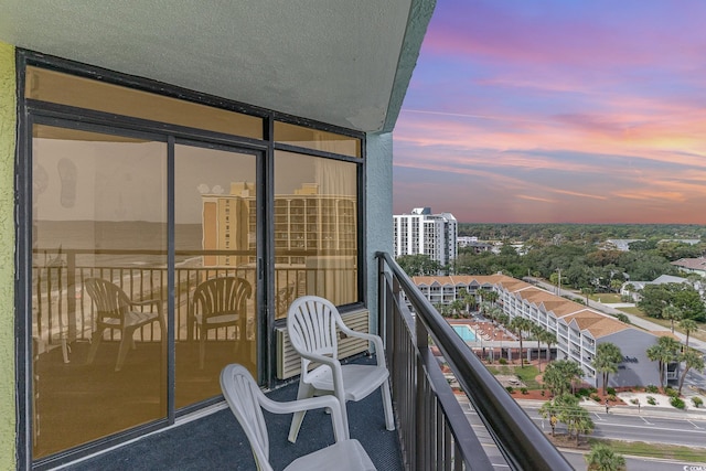 view of balcony at dusk